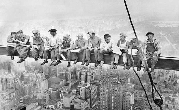 It's a grainy black and white picture that you might have seen before, 13 men sitting on a steel beam, eating lunch with their legs dangling above a 1930's New York skyline at a stomach churning height.   And until recently, the famous picture, sometimes referred to as the "Men on the Beam" picture, was shrouded in a mystery of sorts -- the name of the photographer was never known, or often misattributed. It turns out that a photographer with a colorful past as an one-time actor, auto racer, wrestler, hunter, fisherman and pilot by the name of Charles Ebbets shot the picture in 1932 after he was hired to chronicle the Rockefeller Center's construction during the Depression era.    REUTERS/Bettman/CORBIS